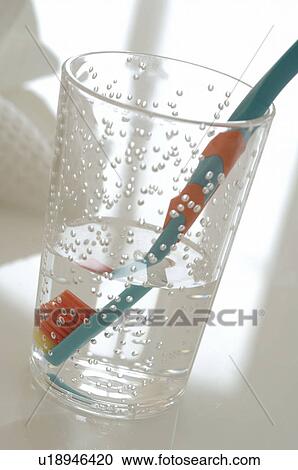 Toothbrush in water View Large Photo Image Stock Image - Toothbrush in water. Fotosearch