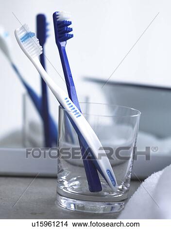 Picture - two toothbrushes in front of a mirror. Fotosearch