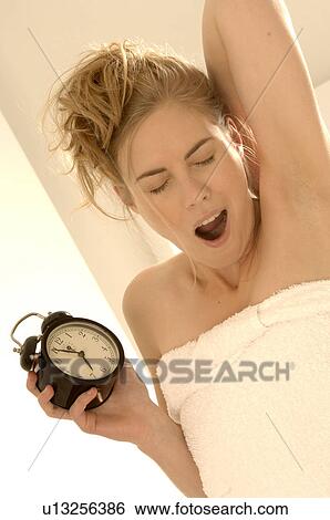 Woman with alarmclock View Large Photo Image Stock Photograph - Woman with alarmclock. Fotosearch