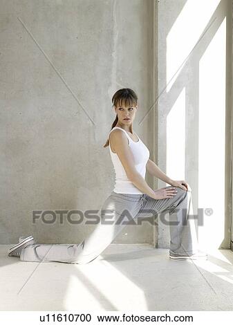 young woman streching her thigh View Large Photo Image Stock Image - young woman streching her thigh. Fotosearch