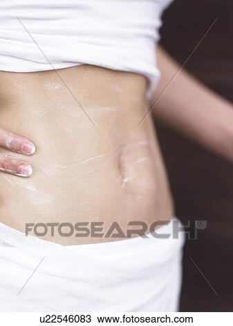creme massage for the belly View Large Photo Image Stock Image - creme massage for the belly. Fotosearch