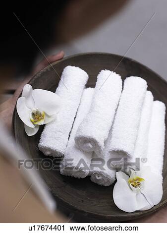Stock Image - towel and orchid blossom. Fotosearch