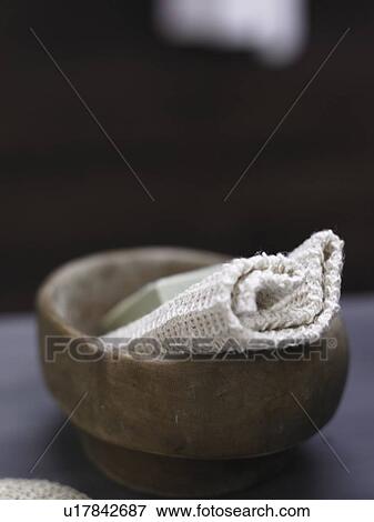 Stock Photo - washcloth in a wooden dash. Fotosearch