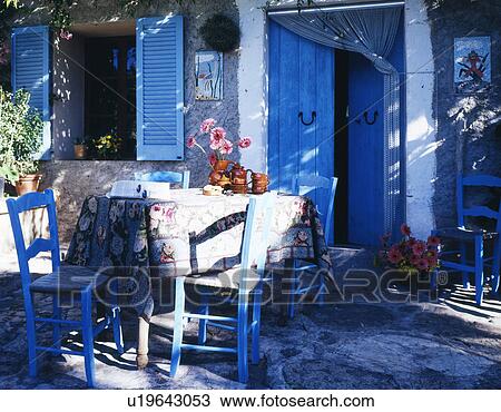 Stock Image - deck chair on a sunny veranda. Fotosearch