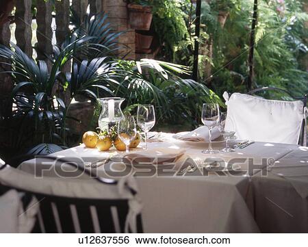 having lunch in the garden View Large Photo Image Stock Photograph - having lunch in the garden. Fotosearch