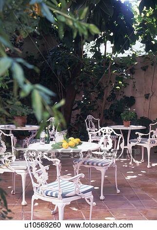 terrace with white iron furniture View Large Photo Image Stock Image - terrace with white iron furniture. Fotosearch