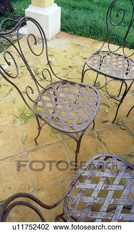 Stock Image - veranda with garden chairs. Fotosearch