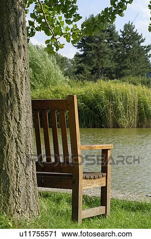Stock Image - wooden bench. Fotosearch