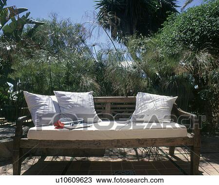 wooden bench with white cushions View Large Photo Image Stock Image - wooden bench with white cushions. Fotosearch