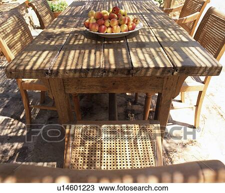 Stock Image - wooden table and chairs. Fotosearch