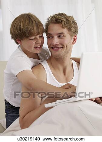 father and son in bed View Large Photo Image Stock Image - father and son in bed. Fotosearch