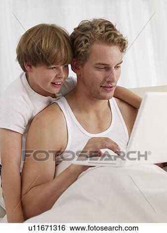 father and son in bed View Large Photo Image Stock Photograph - father and son in bed. Fotosearch
