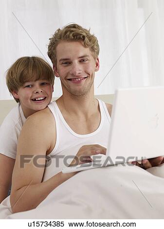 father and son in bed View Large Photo Image Stock Photography - father and son in bed. Fotosearch