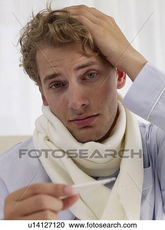 Stock Image - young man down with an influenza. Fotosearch