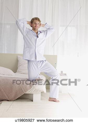 young man in blue pyjamas View Large Photo Image Stock Photo - young man in blue pyjamas. Fotosearch