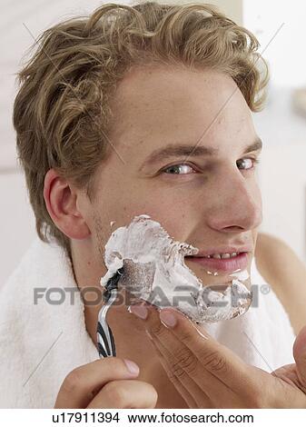 young man shaving View Large Photo Image Picture - young man shaving. Fotosearch
