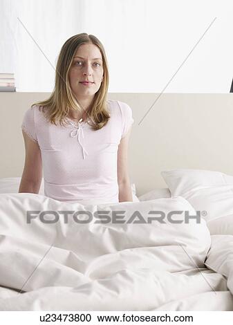 Stock Image - Young woman in nightdress. Fotosearch