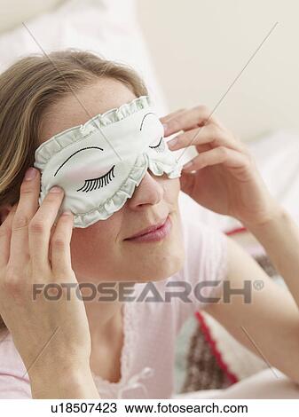 Stock Image - young woman sleeping in daytime. Fotosearch