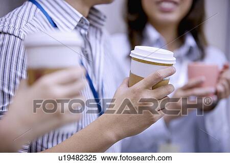 People holding cups of coffee View Large Photo Image Stock Photography - People holding cups of coffee. Fotosearch