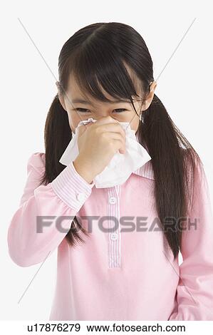 Little girl blowing nose with tissue View Large Photo Image Stock Photo - Little girl blowing nose with tissue. Fotosearch