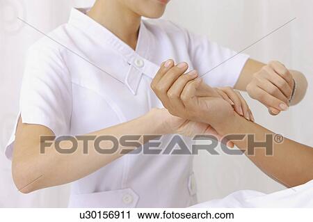 Nurse taking pulse for the patient View Large Photo Image Stock Image - Nurse taking pulse for the patient. Fotosearch