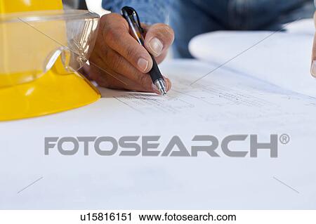Architect's hand drawing blueprint View Large Photo Image Stock Image - Architect's hand drawing blueprint. Fotosearch