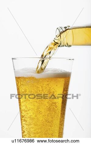 Beer pouring into glass, studio shot View Large Photo Image Stock Photograph - Beer pouring into glass, studio shot. Fotosearch