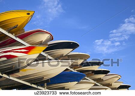 Stock Image - Boats stacked on rack. Fotosearch