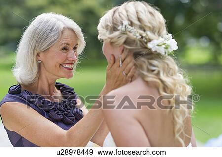 Bride with mother at wedding day View Large Photo Image Stock Photo - Bride with mother at wedding day. Fotosearch