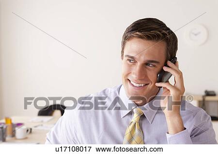 Businessman talking on phone View Large Photo Image Stock Photo - Businessman talking on phone. Fotosearch