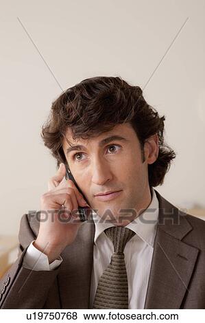 Stock Photo - Businessman talking on phone. Fotosearch
