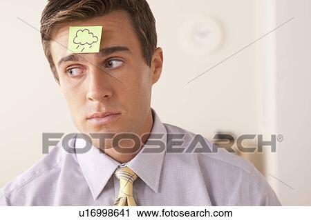 Businessman with adhesive note attached on forehead View Large Photo Image Stock Image - Businessman with adhesive note attached on forehead. Fotosearch