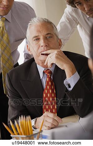 Businessmen at business meeting View Large Photo Image Stock Image - Businessmen at business meeting. Fotosearch