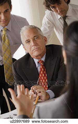 Businessmen at business meeting View Large Photo Image Stock Photo - Businessmen at business meeting. Fotosearch