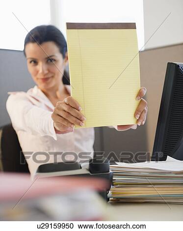 Businesswoman showing blank notepad View Large Photo Image Stock Image - Businesswoman showing blank notepad. Fotosearch