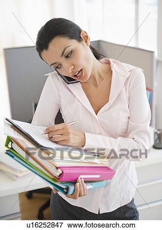 Stock Photo - BusinesswomanWorking in office. Fotosearch