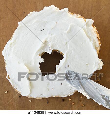 Close up of bagel with cream cheese View Large Photo Image Stock Image - Close up of bagel with cream cheese. Fotosearch