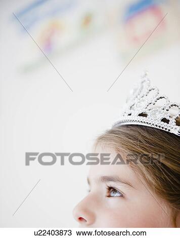 Stock Image - Close up of girl's head ( 6-7) with crown. Fotosearch