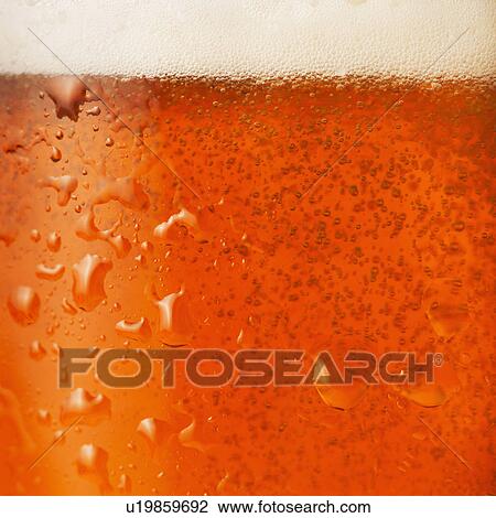 Stock Image - Close-up of lager in glass. Fotosearch