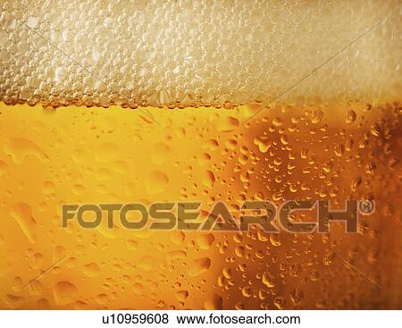 Stock Photo - Close-up of lager in glass. Fotosearch