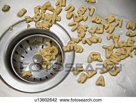 Close up of letter noodles in kitchen sink View Large Photo Image Stock Image - Close up of letter noodles in kitchen sink. Fotosearch