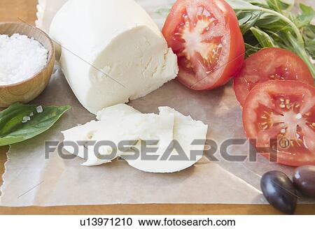 Close up of mozzarella an tomatoes View Large Photo Image Stock Image - Close up of mozzarella an tomatoes. Fotosearch