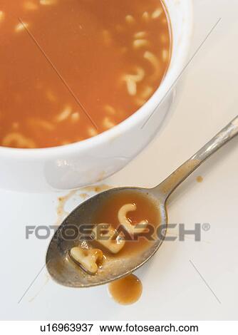 Close up of soup with letter noodles on spoon View Large Photo Image Stock Photo - Close up of soup with letter noodles on spoon . Fotosearch