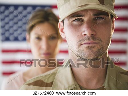 Close up ofsoldier and his girlfriend with american flag in background View Large Photo Image Stock Image - Close up ofsoldier and his girlfriend with american flag in background. Fotosearch