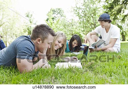 College students relaxing on grass View Large Photo Image Stock Image - College students relaxing on grass. Fotosearch