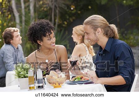 Couple dining in outdoor restaurant View Large Photo Image Picture - Couple dining in outdoor restaurant. Fotosearch