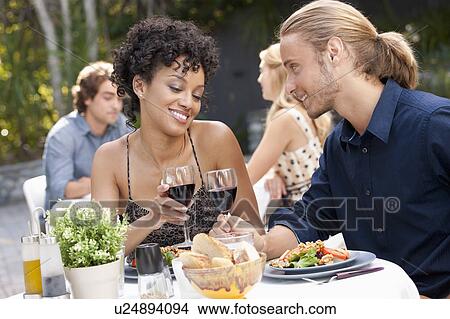 Couple dining in outdoor restaurant View Large Photo Image Picture - Couple dining in outdoor restaurant. Fotosearch