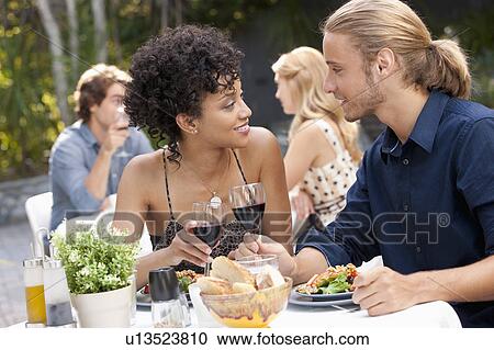 Couple dining in outdoor restaurant View Large Photo Image Stock Image - Couple dining in outdoor restaurant. Fotosearch