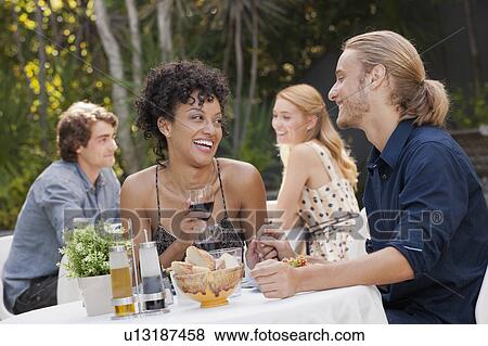 Couple dining in outdoor restaurant View Large Photo Image Stock Photo - Couple dining in outdoor restaurant. Fotosearch