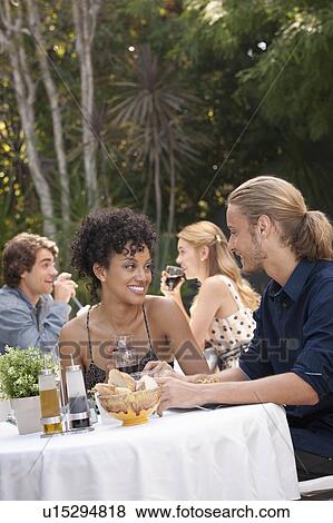 Couple dining in outdoor restaurant View Large Photo Image Stock Photo - Couple dining in outdoor restaurant. Fotosearch